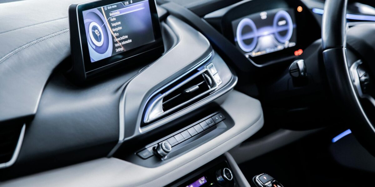 Luxury car interior showcasing advanced dashboard technology and sleek design elements.