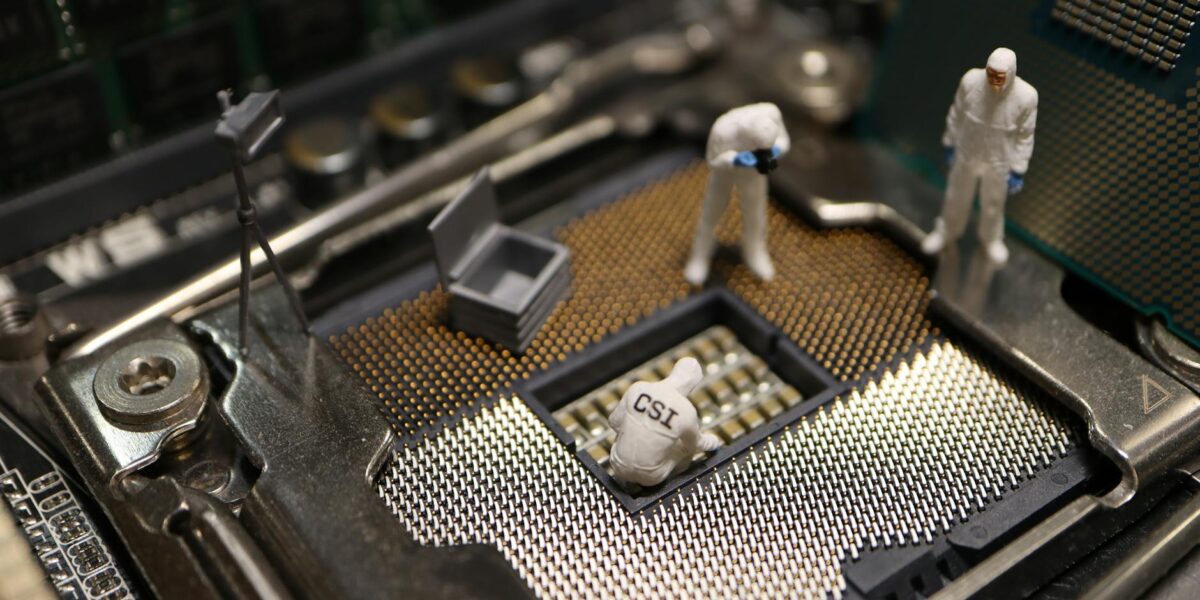 Tiny CSI figures conduct an investigation on a CPU, blending technology with creativity.
