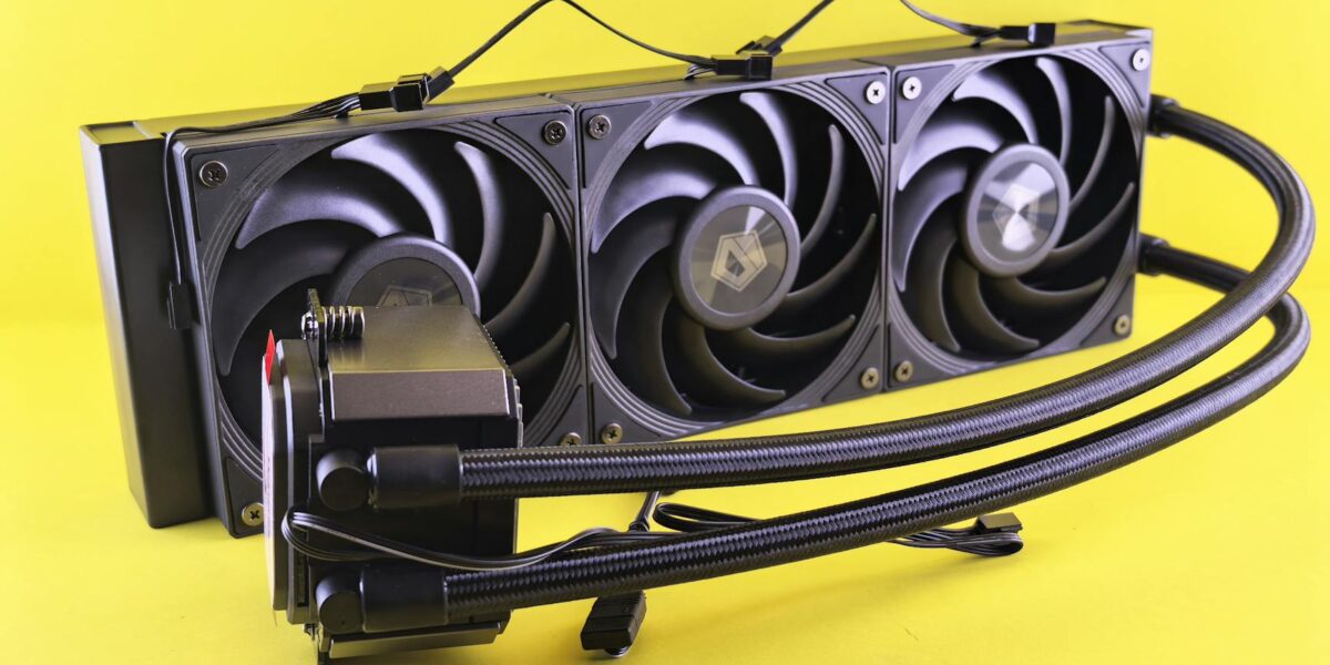 Triple fan liquid cooling system for efficient PC cooling on bright yellow background.