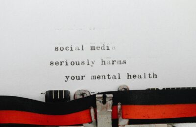 Vintage typewriter conveying message on social media's impact on mental health.