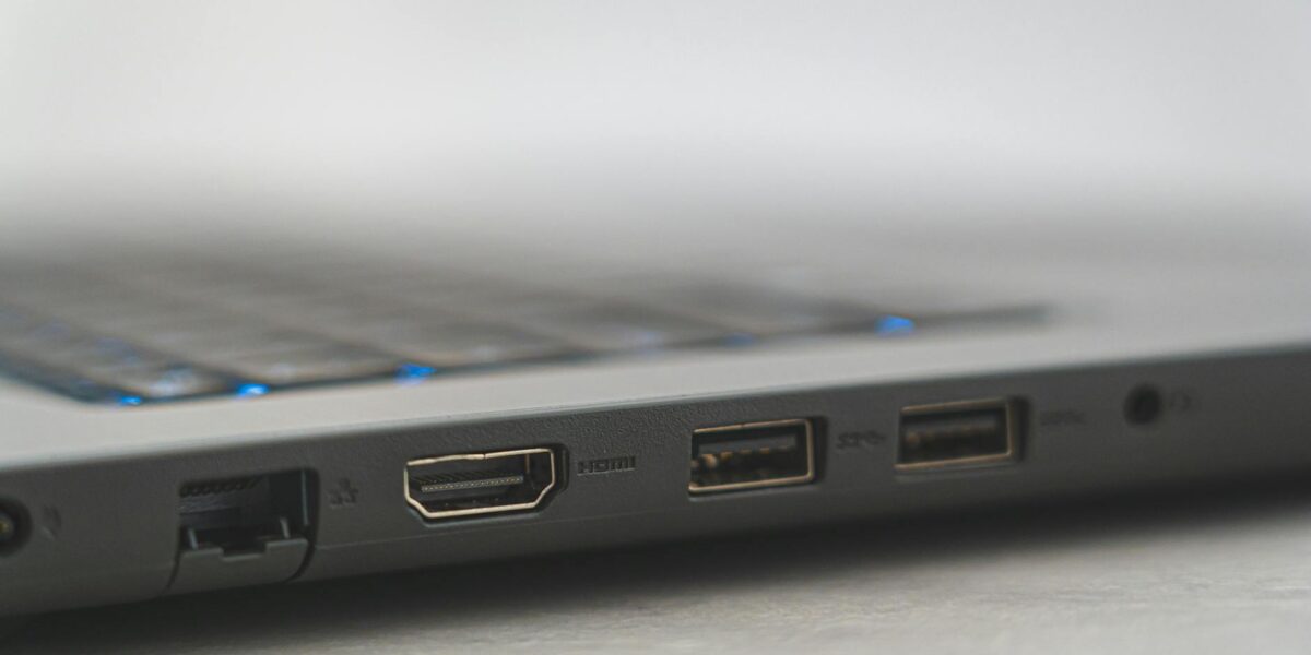 Detailed view of laptop ports including HDMI, USB, and Ethernet, showcasing connectivity options.