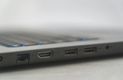 Detailed view of laptop ports including HDMI, USB, and Ethernet, showcasing connectivity options.