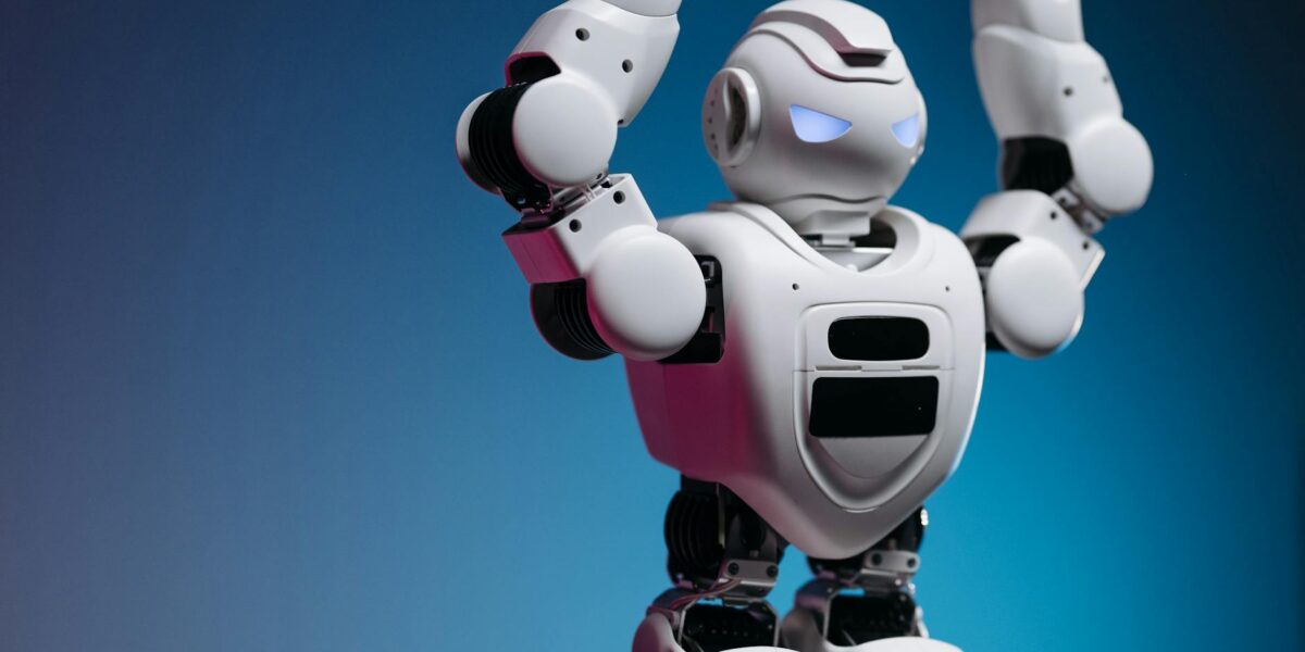 A white humanoid robot in a studio setting showcasing advanced robotics and modern technology.