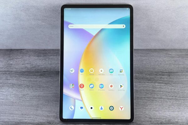 Front view of a modern tablet showing a colorful home interface with various app icons on display.