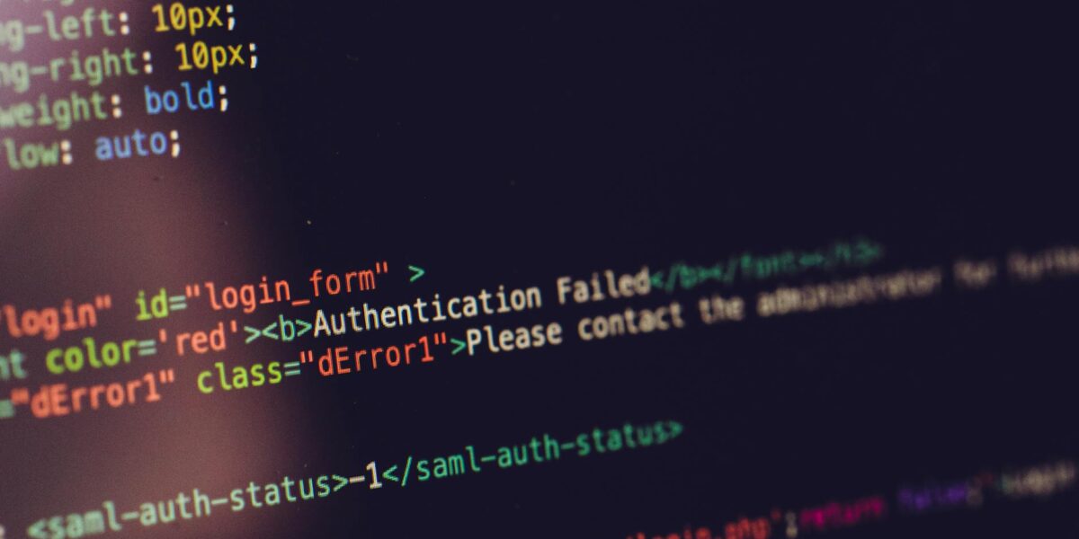 Close view of computer screen displaying HTML code with an authentication error.