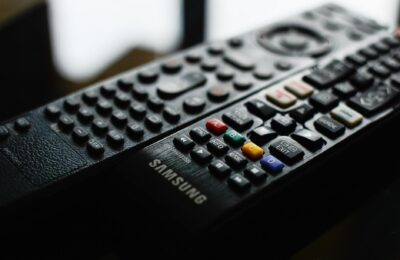 Detailed close-up of a Samsung remote control showcasing buttons and logo.