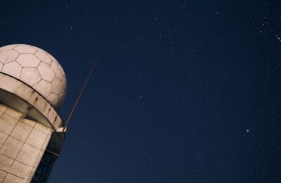 A stunning view of a starry night sky above an observatory dome, capturing the beauty of the cosmos.