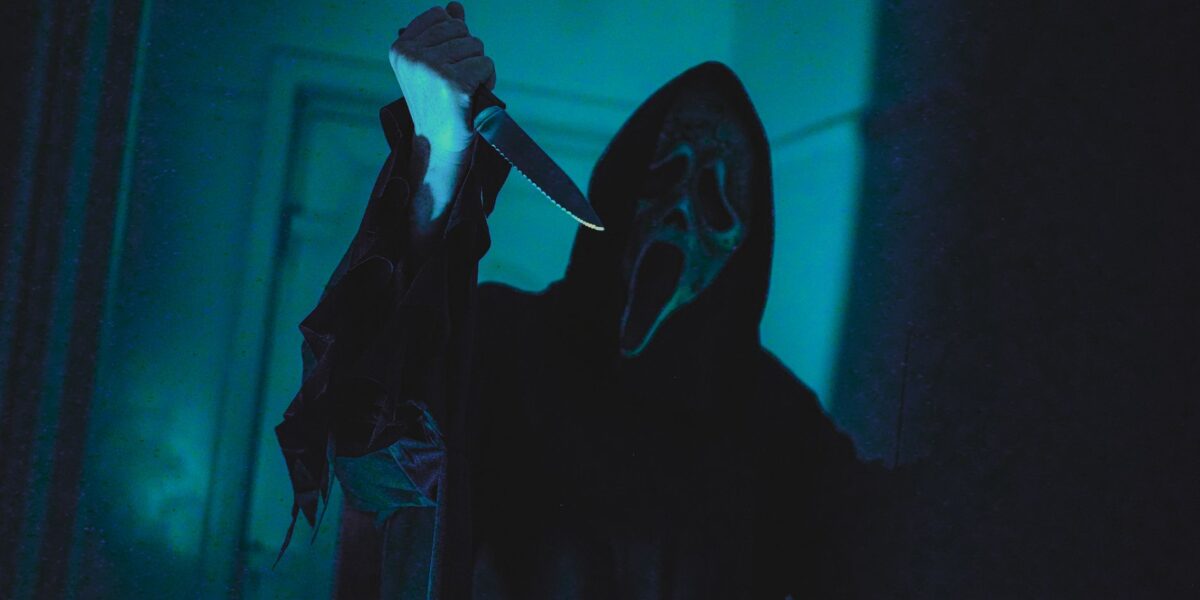 Dark, eerie scene with a masked figure holding a knife, evoking horror film vibes.