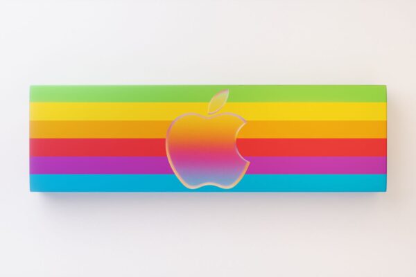 Vibrant rainbow design featuring iconic apple logo against a white backdrop, ideal for brand displays.