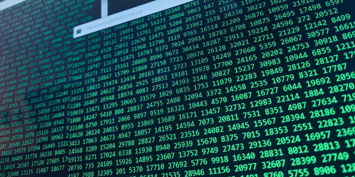 Vibrant green numbers on a computer screen, showcasing binary code and data streams.