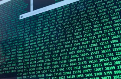 Vibrant green numbers on a computer screen, showcasing binary code and data streams.