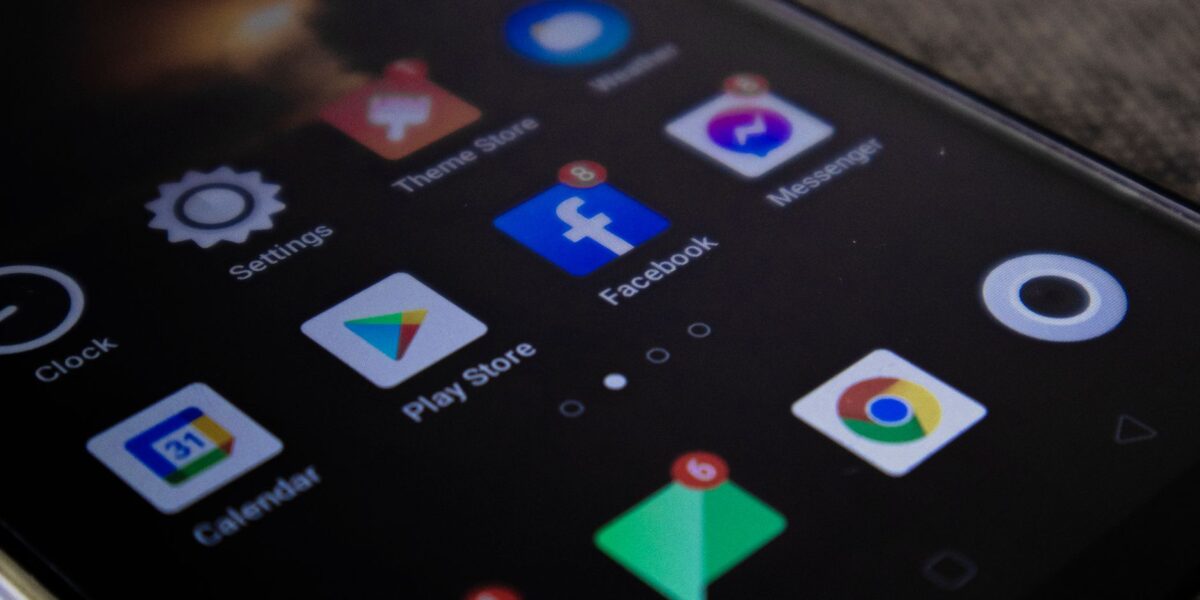 Detailed view of a smartphone screen with popular app icons including Facebook and Messenger.