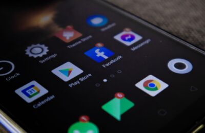 Detailed view of a smartphone screen with popular app icons including Facebook and Messenger.