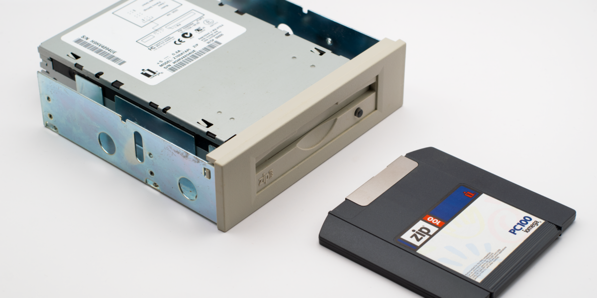 Retro Zip drive with a Zip diskette, highlighting old computer storage technology.