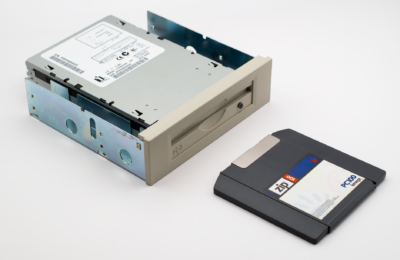 Retro Zip drive with a Zip diskette, highlighting old computer storage technology.