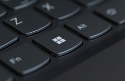Detailed close-up of a computer keyboard featuring the Windows key in focus.