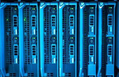 Detailed image of illuminated server racks showcasing modern technology infrastructure.
