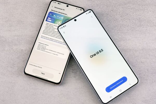 Two smartphones are shown displaying a software update screen with One UI 8.5.