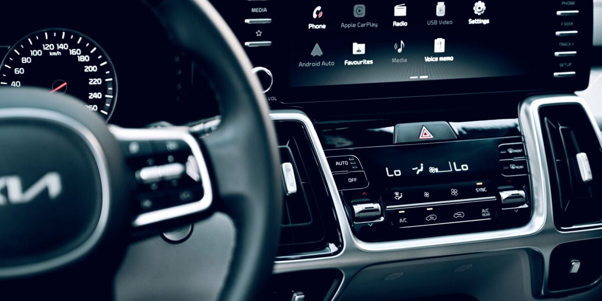 Close-up view of a luxury car's dashboard featuring a modern touchscreen display and advanced features.