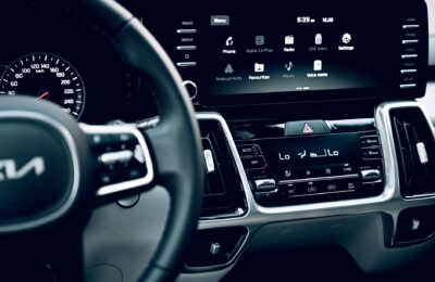 Close-up view of a luxury car's dashboard featuring a modern touchscreen display and advanced features.