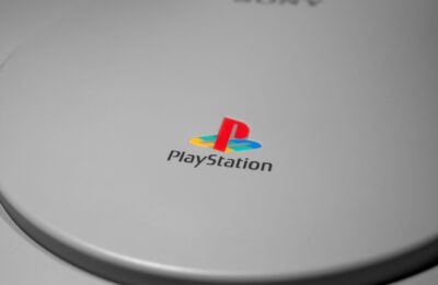 Detailed close-up of iconic PlayStation console logo, perfect for gaming-related content.