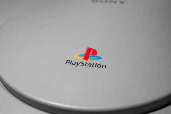 Detailed close-up of iconic PlayStation console logo, perfect for gaming-related content.