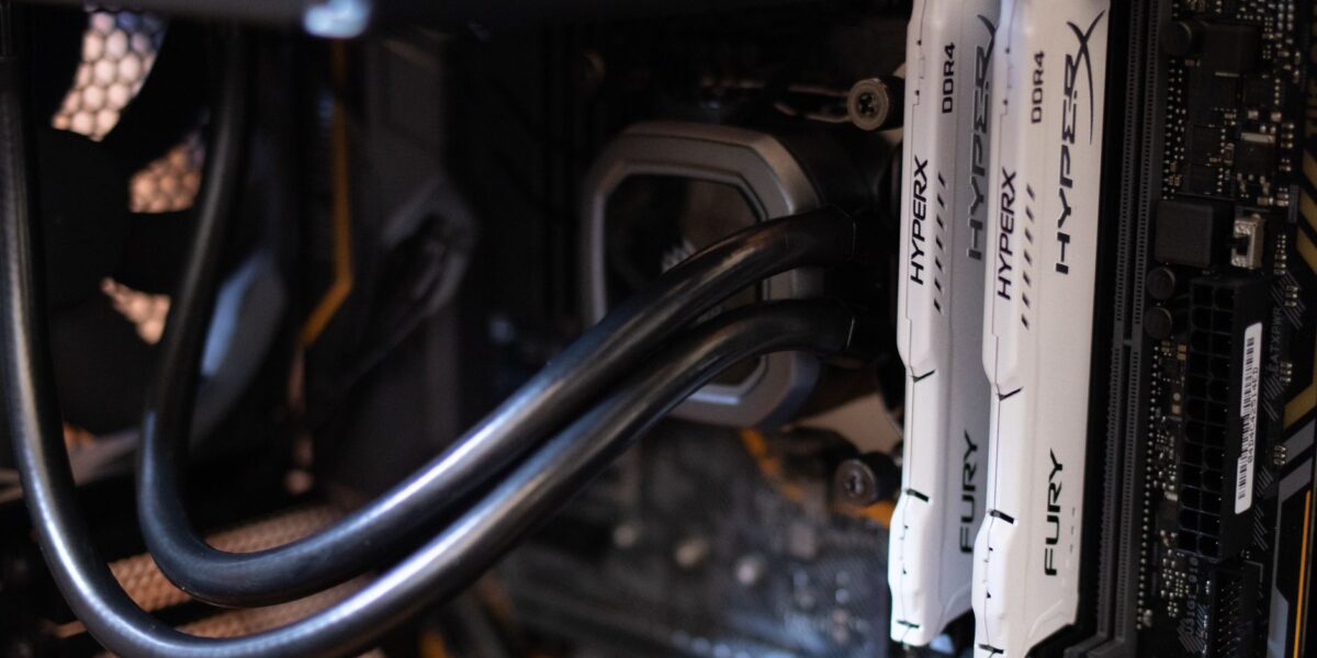 Detailed close-up of computer components including RAM and cables inside a server or high-performance PC.