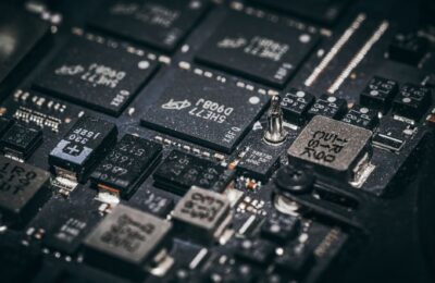 Detailed close-up of electronic microchips on a circuit board, showcasing technology and engineering intricacies.