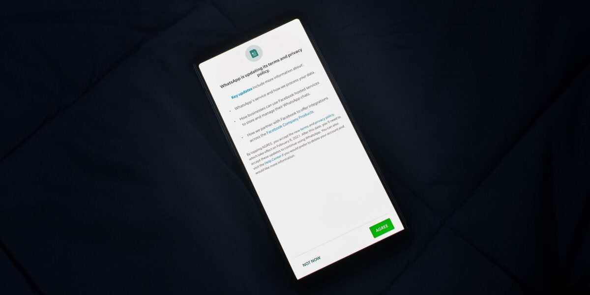 Close-up of smartphone screen showing a privacy policy update agreement.