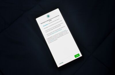 Close-up of smartphone screen showing a privacy policy update agreement.