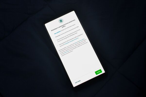 Close-up of smartphone screen showing a privacy policy update agreement.