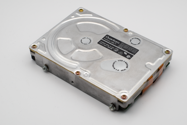 Retro Quantum ProDrive hard disk drive on a light background, showcasing vintage computer technology.