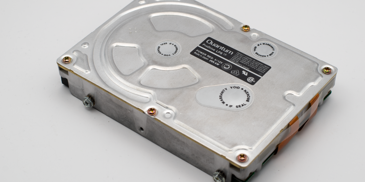 Retro Quantum ProDrive hard disk drive on a light background, showcasing vintage computer technology.