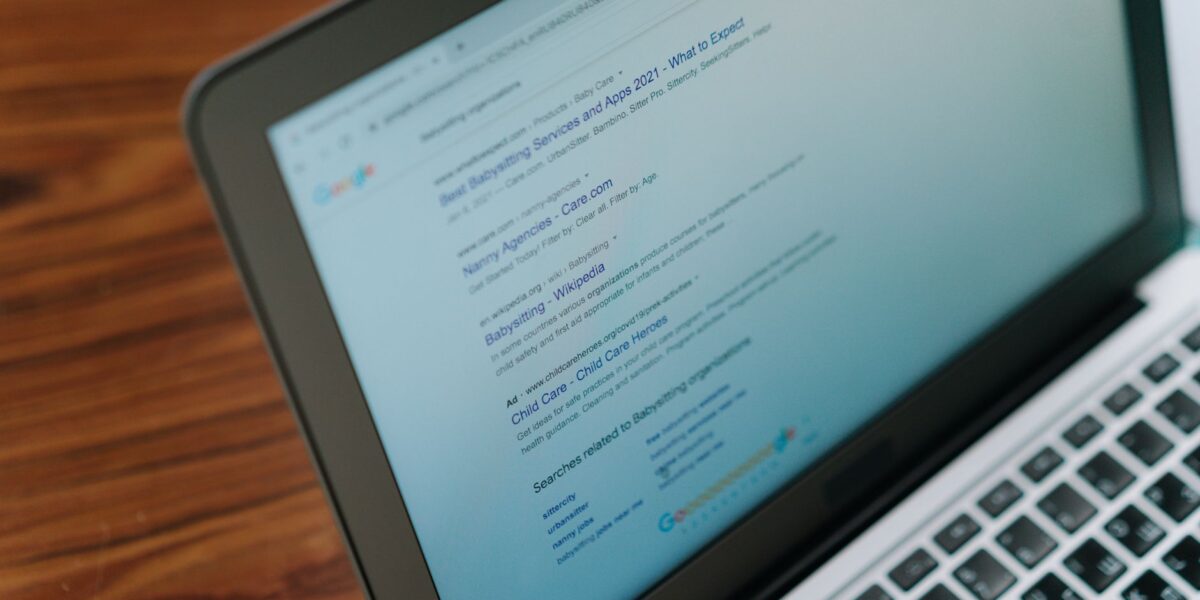 A close-up view of a laptop displaying a search engine page.