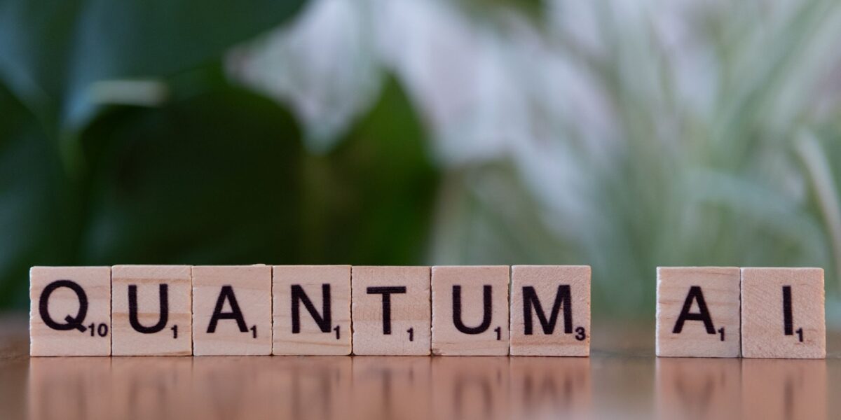 Wooden letter tiles spelling 'Quantum AI' on a blurred background.