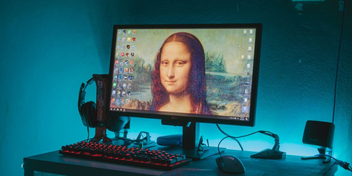Mona Lisa on a computer desktop in a tech-inspired gaming setup with vibrant LED lighting.