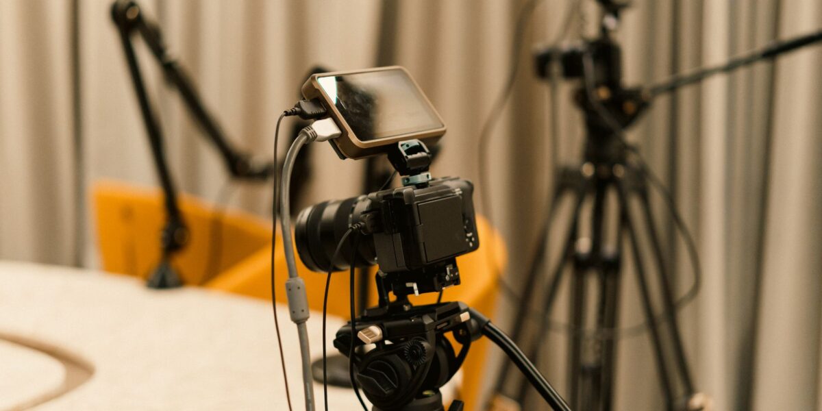 A professional studio with cameras, microphones, and other equipment ready for recording or live streaming.