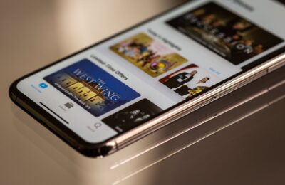 Close-up view of a smartphone featuring a streaming service interface, highlighting technology in modern entertainment.