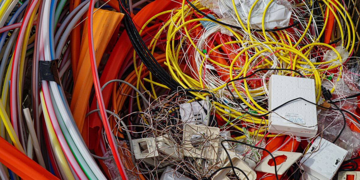 A vibrant mixture of electrical cables and waste ready for recycling.