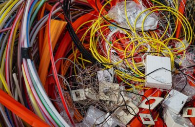 A vibrant mixture of electrical cables and waste ready for recycling.