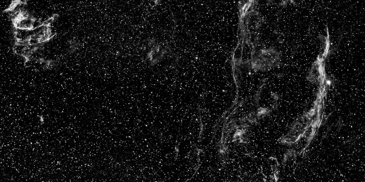 An awe-inspiring view of a supernova remnant amidst a field of stars in space.