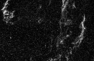 An awe-inspiring view of a supernova remnant amidst a field of stars in space.