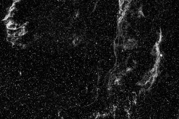 An awe-inspiring view of a supernova remnant amidst a field of stars in space.