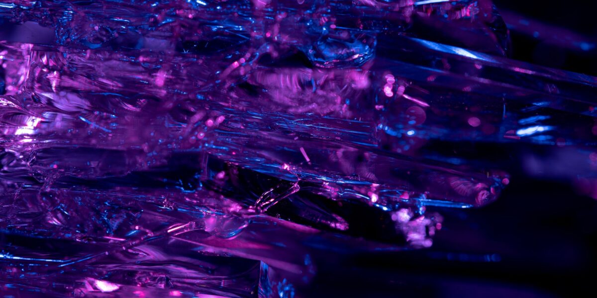 Stunning macro shot of purple and blue crystals, revealing intricate textures and vibrant colors.