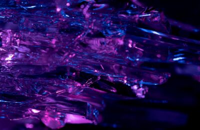 Stunning macro shot of purple and blue crystals, revealing intricate textures and vibrant colors.