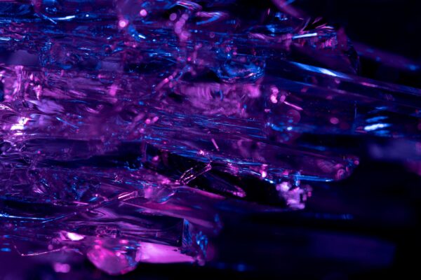 Stunning macro shot of purple and blue crystals, revealing intricate textures and vibrant colors.