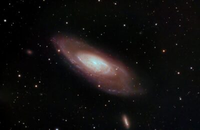 A captivating image of a spiral galaxy surrounded by stars in deep space, showcasing cosmic beauty.