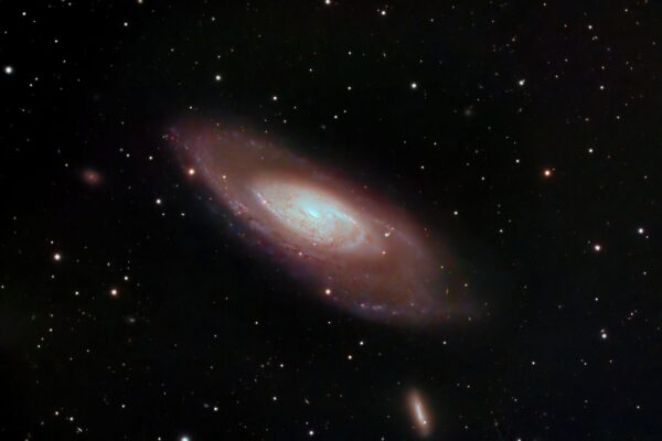 A captivating image of a spiral galaxy surrounded by stars in deep space, showcasing cosmic beauty.