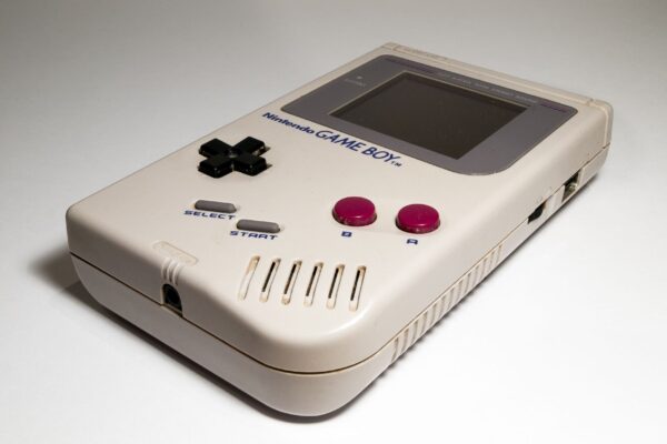 Close-up of a classic Nintendo Game Boy handheld console, iconic retro gaming device.