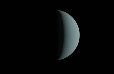 Half-lit planet resembling a crescent against a dark space backdrop.